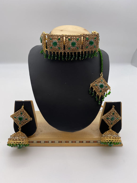 Choker Set in Gold Base with Green Stones and Adjustable Necklace with Tikka and Jhumki Earrings